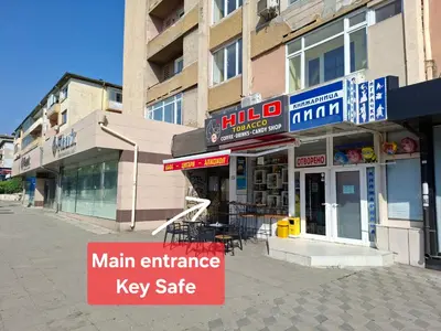 a main entrance to a key gate on a city street at 3 Rooms Apartment, Top Center, 1st Floor Flat, AUBG, WiFi, PC i5 SSD, Tablet, AndroidMiTvBox, 3 LED TVs 200 Channels, Long Terrace, Self-Easy-Late Check-in, Stay Before Greece in Blagoevgrad