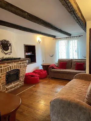 a living room with a couch and a fireplace at Chalet Mila - Total Chalets - Fully Catered in Bansko