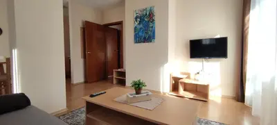 a living room with a couch and a table at Apartment SUNNY&RELAX Pamporovo The Castle 2 in Pamporovo