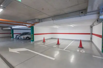 a parking lot with orange cones in a parking garage at Complex Gallery Vitosha **** in Sofia