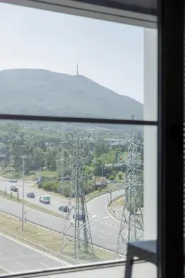 a view of a highway from a window at Green Eyes Apartments in Sofia