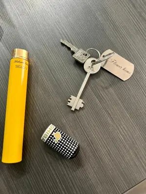 a group of keys and a remote control on a table at Flower house 7 in Sofia