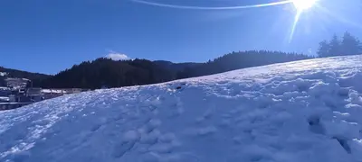 a pile of snow on the side of a mountain at Marina apartment in Stoykite
