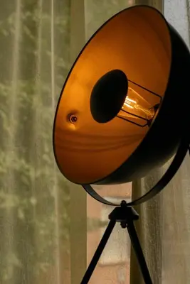 a light that is on top of a tripod at Cozy studio with FRENCH WINDOWS in Plovdiv