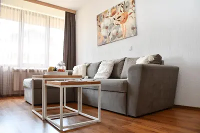 a living room with a couch and a table at Comfort 37 - Luxury ski apartment near the gondola in Bansko