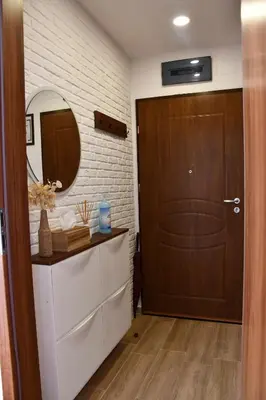 a bathroom with a brown door and a mirror at Comfort 37 - Luxury ski apartment near the gondola in Bansko