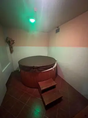 a large tub in a room with a green light at Comfort 37 - Luxury ski apartment near the gondola in Bansko