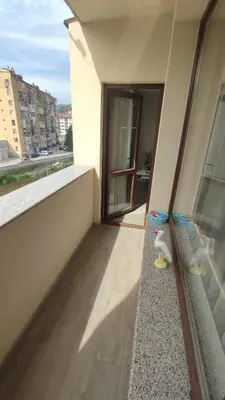 a balcony with a view of a building at Апартамент Relax in Smolyan