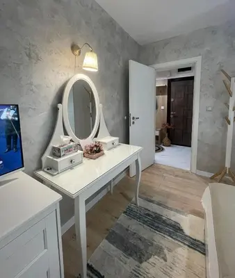 a bathroom with a dressing table with a mirror at Boutique apartment Bansko Bell Tower in Bansko