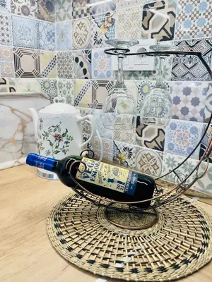 a bottle of wine sitting on a basket at Boutique apartment Bansko Bell Tower in Bansko