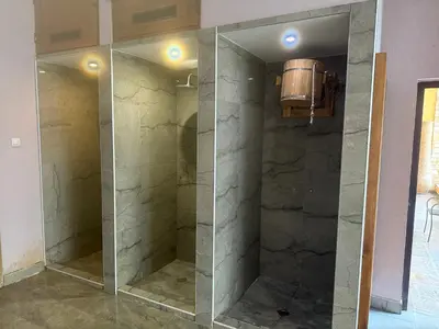 a walk in shower with a glass door at Мия 2 Спа хотел Свети Спас in Velingrad