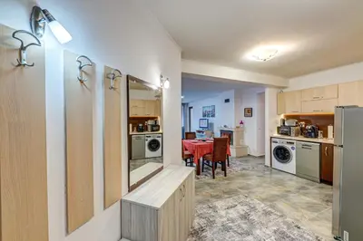a kitchen with a table and a dining room at Bright and Spacious 2-BDR Apartment with Balcony by Flat Mаnager in Pamporovo