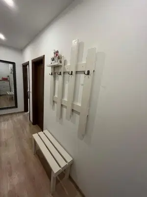 a white room with a bench on a wall at Апартамент Ламартин- в сърцето на Пловдив in Plovdiv