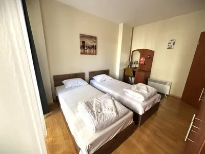 a hotel room with two beds in a room at Bansko Apartment Predela the One in Bansko