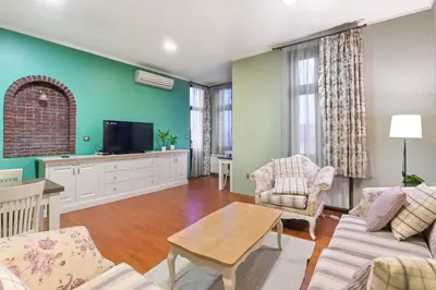 a living room with a couch and a tv at Life in Colors - Elegant 2BD Premium Stay by Flat Mаnager in Sofia