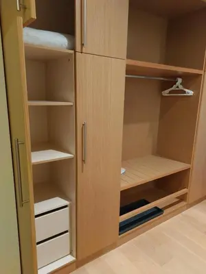 a cupboard with a door open to a closet at Residence E205 Euphoria Borovets in Borovets