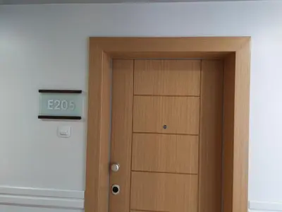 a door with a clock on top of it at Residence E205 Euphoria Borovets in Borovets