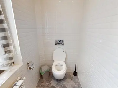 a small bathroom with a toilet in a stall at A Lovely 2BR Apartment in the heart of Sofia - NDK in Sofia