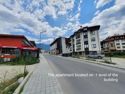 an empty street in a town with buildings at Mila Apartment in Bansko