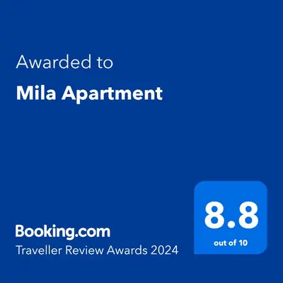 a blue screen with the text awarded to milk appointment at Mila Apartment in Bansko