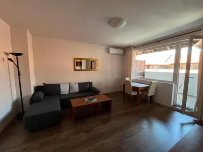 a living room with a couch and a table at Bansko Royal Towers 253 in Bansko