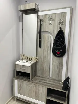 a bathroom with a mirror and a shelf with a towel at Central Vista Apartment by MIT in Sofia