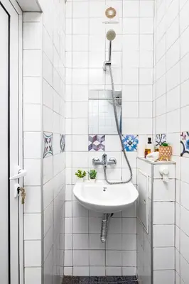 a white bathroom with a sink and a shower at House Of History , Rooms in the Main Street Plovdiv in Plovdiv