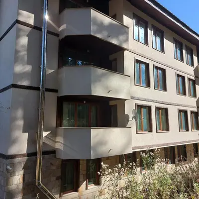 a building with balconies on the side of it at Апартамент Николови Пампорово in Pamporovo