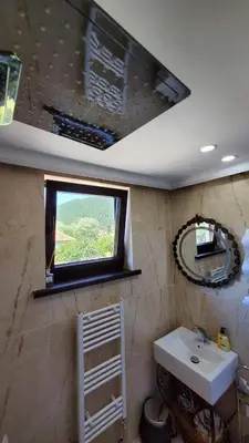 a bathroom with a sink and a window at Bulgarane House in Govedartsi