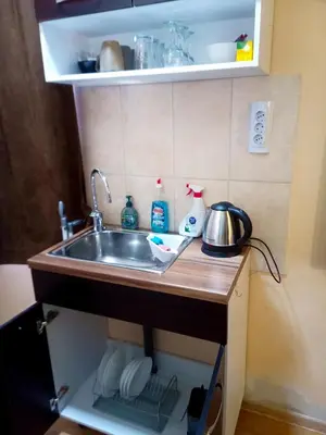a kitchen counter with a sink in a room at Апартамент в центъра на София - plus Free Vouchers in Sofia