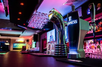 a bar with a drink dispenser on the counter at Snow Line Suites SLS in Bansko