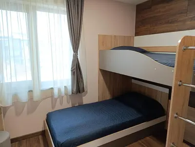 a bunk bed in a room with a window at Lime House, Kyustendil in Kyustendil