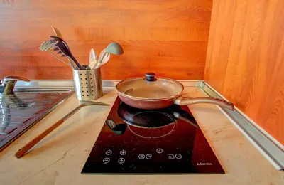 a pot on top of a stove in a kitchen at 1BD Nest in the heart of a traditional Sofia by Flat Mаnager in Sofia