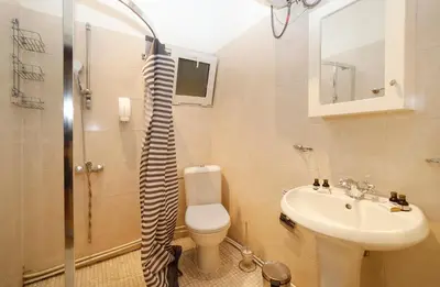 a bathroom with a toilet and a sink and a shower at Chalet Iskar Borovets by BookVillaBG in Borovets