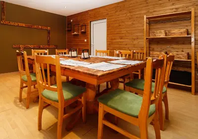 a dining room with a wooden table and chairs at Chalet Iskar Borovets by BookVillaBG in Borovets