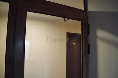 a door to a room with the word floor on it at Elinor Apartment - Downtown in Bansko