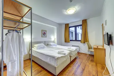 a bedroom with a bunk bed and a mirror at Complex Silver Hills in Smolyan