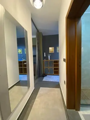 a hallway with a large mirror in a room at Cozy mountain apartament near the Gondola lift in Bansko