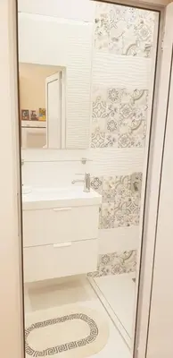 a bathroom with a sink and a mirror at Graf Ignatiev Central Apartment in Sofia
