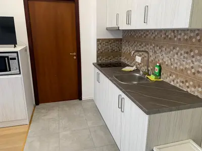 a kitchen with a sink and a microwave at Flora Clover One Bedroom Apartment nr. 18 in Borovets