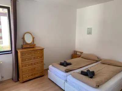 a bedroom with a bed and a dresser and a mirror at Flora Clover One Bedroom Apartment nr. 18 in Borovets