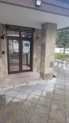 a building with a door with the words worst evidence at Arboro Flora Residence Studio in Borovets