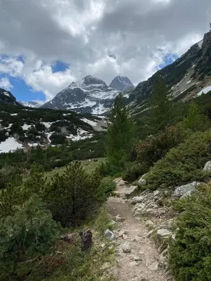 a dirt trail with mountains in the background at Hotel Alpinist, Malyovitsa in Govedartsi