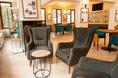 a store with chairs and tables in a room at Hotel Alpinist, Malyovitsa in Govedartsi