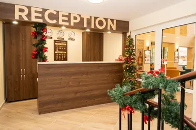 a reception area in a store with christmas decorations at Hotel Alpinist, Malyovitsa in Govedartsi