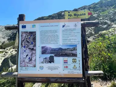 a interpretive sign on the side of a mountain at Arboro Borovets Gardens E43 in Borovets