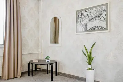 a room with a table and a picture on the wall at Budget Stay in City Center near NDK in Sofia