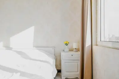a bedroom with a white bed and a window at Budget Stay in City Center near NDK in Sofia