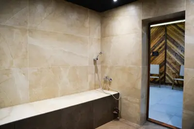 a bathroom with a shower with a tub at Sana Ski apartment 620 in Flora, Borovets in Borovets