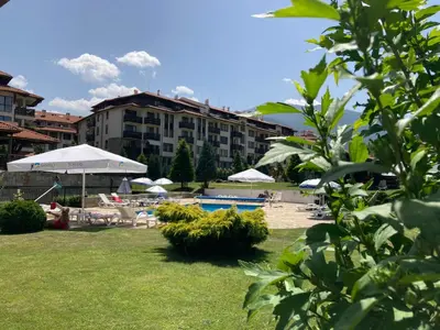 a resort with a swimming pool and a hotel at Studio Stankovic Royal Towers 326 in Bansko